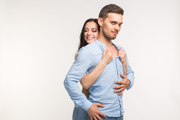 Naklejka premium Relationship and love concept - Portrait of funny couple on white background with copy space
