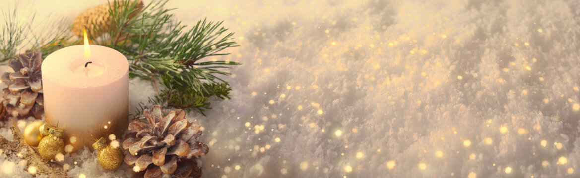 Christmas Winter Panorama  -  White candle in sparkling snow landscape