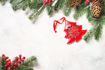 Fototapeta na wymiar Christmas background with fir tree and cones on white backgroun