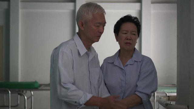 Asian senior elderly couple bad news on health at hospital