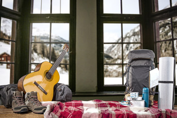 Backpack on table and retro window landscape 