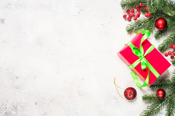 Fototapeta na wymiar Christmas background with fir tree, red present box and decorati