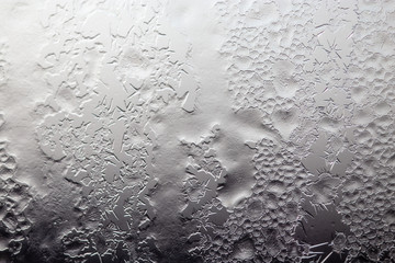 Snow patterns on glass as an abstract background
