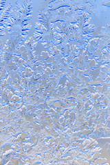 Snow patterns on glass as an abstract background