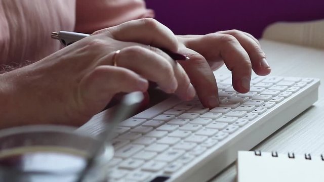 Close up of a man using computer / HD stock footage of person's hands typing on computer keyboard