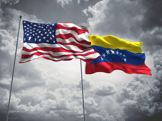 United States of America, USA & Venezuela Flags are waving in the sky with dark clouds