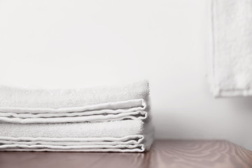 Fototapeta na wymiar White terry towels on wooden table indoors