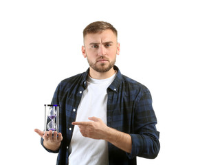 Grumpy man with hourglass on white background