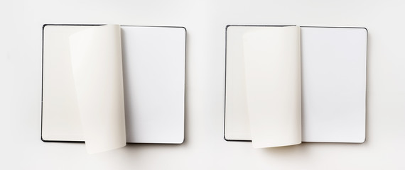 Top view of black notebook with curl rolled page