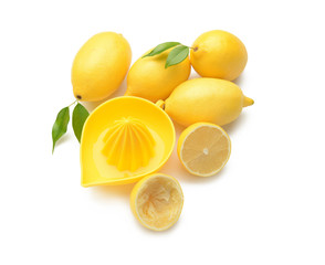 Pile of fresh whole and cut lemons on white background