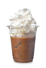 Cold coffee covered with whipped cream in plastic cup on white background