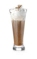 Cold coffee covered with whipped cream and chocolate in glass on white background