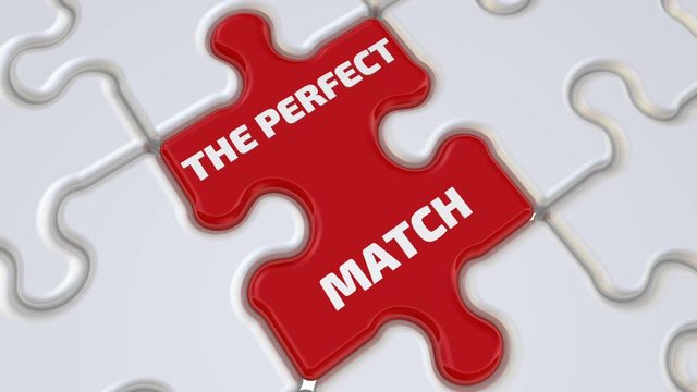 The perfect match. The inscription on the missing element of the puzzle. Folding white puzzles elements and one red with word THE PERFECT MATCH. Footage video