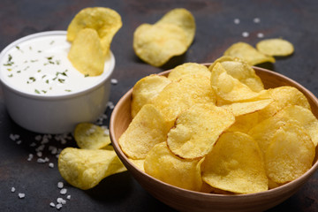 Potato chips with sauce dip and salt