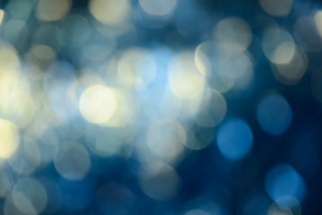 Bokeh photo. Holiday background. Christmas lights. background. Defocused sparkles. New Year...