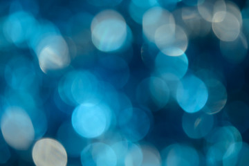 Bokeh photo. Holiday background. Christmas lights. background. Defocused sparkles. New Year...