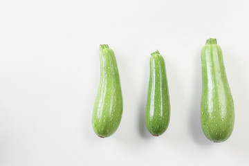 Fresh squashes on white background