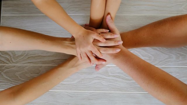 People joining hands, family concept. Top view