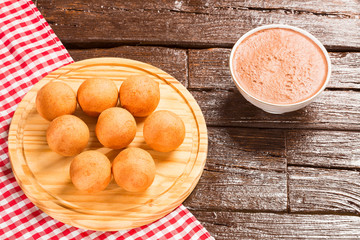 Traditional Colombian buñuelo - Deep Fried Cheese Bread. Hot chocolate drink