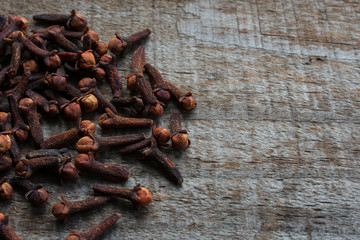 Cloves on wooden background