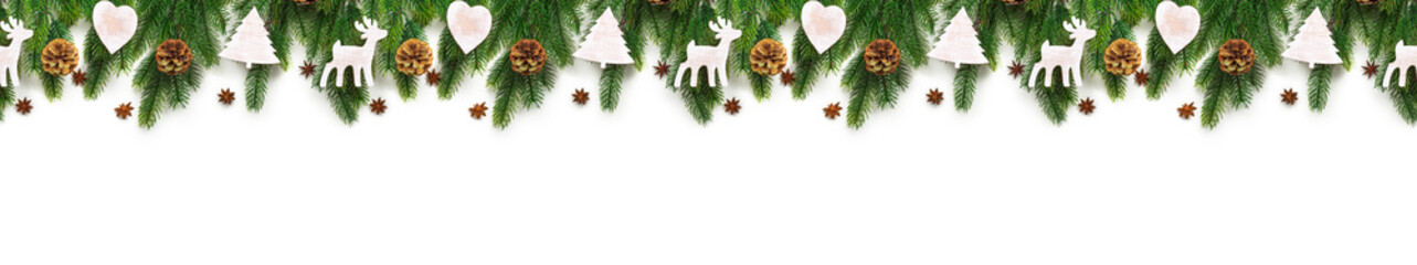 Christmas tree branches on white background as a border