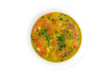 vegetable broth in a white plate isolated on white background. top view. flat lay