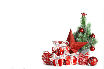 Christmas gift boxes with ball and big star isolated on white background