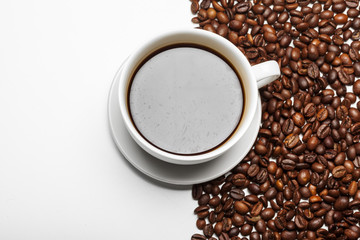 Coffee cup and beans on a white background
