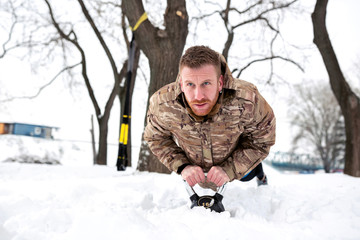 Fototapeta na wymiar Kettlebell push ups on the snow