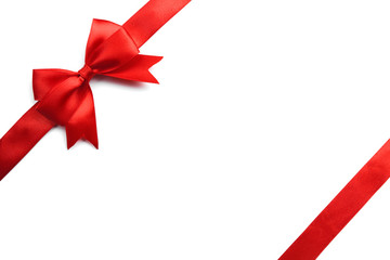 Shiny red satin ribbon on white background