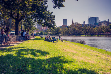 People lay down on the bank of Yarra River. 4 PM, 25 February, 2017