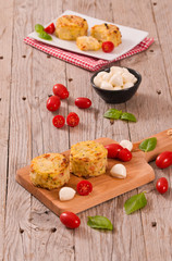 Fototapeta na wymiar Potato gratins with mozzarella and tomatoes.