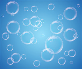 Set of transparent bubbles on blue background