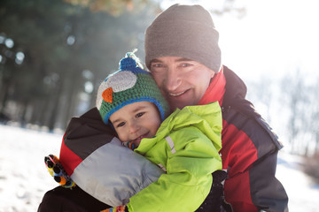 Fototapeta premium Granddad hugging his cute grandson