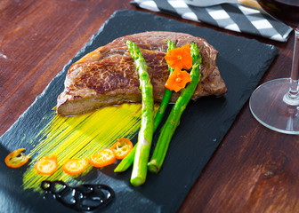 Well done beef steak with asparagus