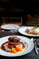 Tender beef Filet mignon steak with red wine gravy sauce. Close up side view shot