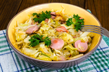Stewed cabbage with slices of sausages