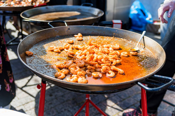 Pan with roasted prawns for sale outdoors