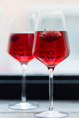 Strawberry in champagne in glasses