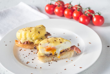 Eggs Benedict on the white plate