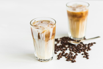 Delicious drink concept - Iced coffee in a glass with ice.