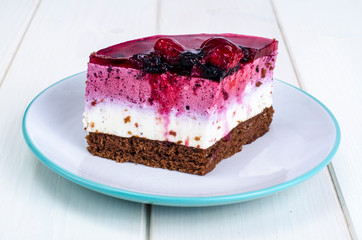 Piece of cake with berries and jelly