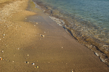 sea shore line local south nature landscape with waterfront sand and blue small waves 
