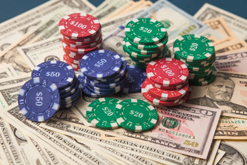 Poker chips and dollars. win