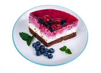 Piece of cake with berries and jelly