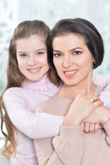 Portrait of a charming girl with mom