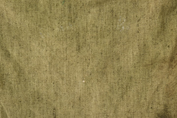 The texture of fiber of a sack khaki coloured.
