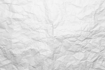 Background of a crumpled white sheet of a paper.