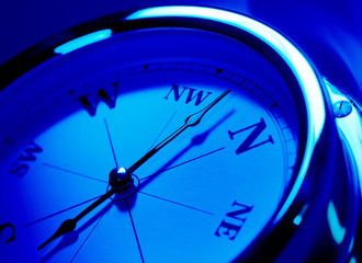 Fototapeta na wymiar close up of a compass with a blue tone effect