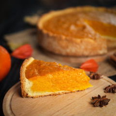 traditional pumpkin pie on the table. autumn composition